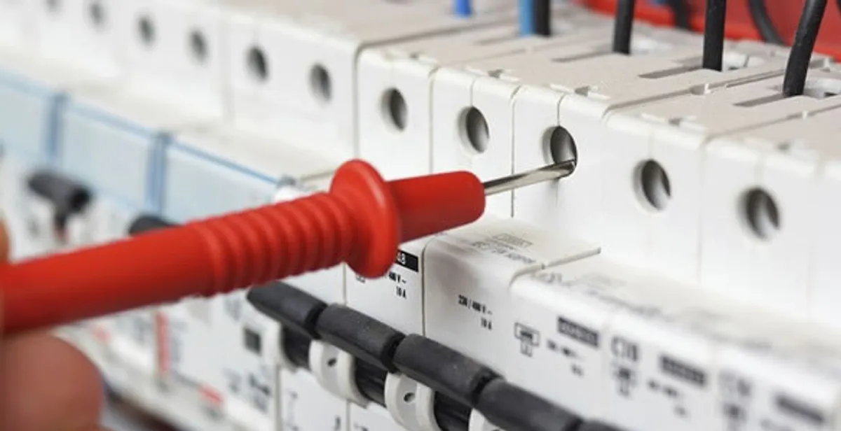 Electrical contractor testing circuit breakers during electrical repair in Gotha, FL